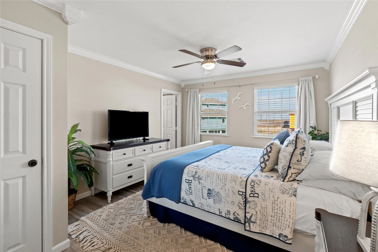 Primary bedroom with king size bed and attached bath